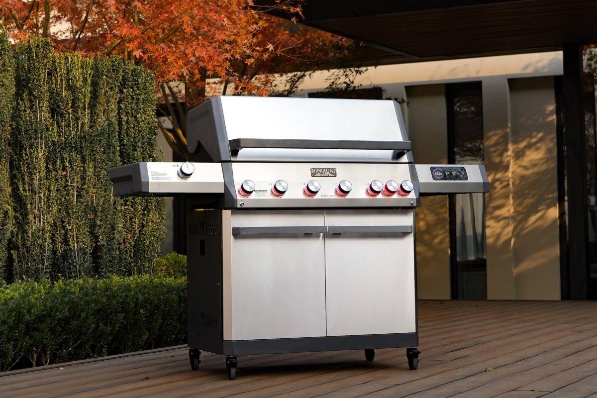 Monument Grills' Eminence 605 grill standing in a backyard
